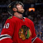 Elias Pettersson Trade Rumor: Why the Vancouver Canucks Center Fits the Chicago Blackhawks Elias Pettersson wearing a Chicago Blackhawks home jersey and helmet amid NHL trade rumors involving the Vancouver Canucks