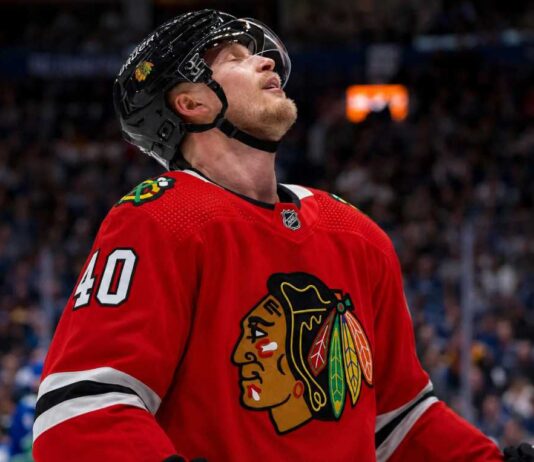 Elias Pettersson Trade Rumor: Why the Vancouver Canucks Center Fits the Chicago Blackhawks Elias Pettersson wearing a Chicago Blackhawks home jersey and helmet amid NHL trade rumors involving the Vancouver Canucks