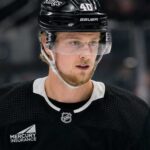 Elias Pettersson wearing a Los Angeles Kings home jersey and helmet amid trade speculation involving the Vancouver Canucks