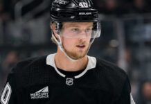 Elias Pettersson wearing a Los Angeles Kings home jersey and helmet amid trade speculation involving the Vancouver Canucks