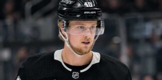 Elias Pettersson wearing a Los Angeles Kings home jersey and helmet amid trade speculation involving the Vancouver Canucks