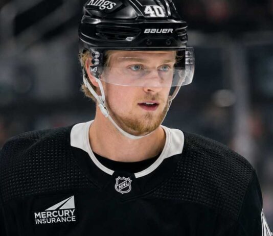 Elias Pettersson wearing a Los Angeles Kings home jersey and helmet amid trade speculation involving the Vancouver Canucks