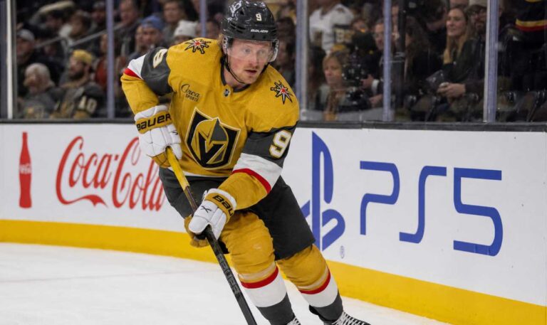 Jack Eichel skating for the Vegas Golden Knights beside Coca-Cola and PS5 rink-board ads during his projected 2026-27 Fantasy Hockey season.