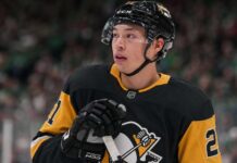 Jason Robertson wearing a Pittsburgh Penguins home jersey in NHL trade rumors linking the Dallas Stars star to Pittsburgh after Nick Robertson trade