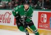 Jason Robertson Point Projections 2026-27: Will the Dallas Stars Star Reach 100? Jason Robertson skating in a Dallas Stars home jersey beside Coca-Cola and Nintendo Switch rink board ads for his 2026-27 fantasy hockey projection