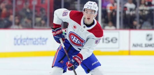 Lane Hutson Point Projections for the 2026–27 NHL Season Lane Hutson skating for the Montreal Canadiens during a game ahead of his 2026-27 Fantasy Hockey point projection.