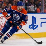 Leon Draisaitl Point Projections 2026-27: Can He Reach 120 Points? Leon Draisaitl skating in an Edmonton Oilers home jersey during his projected 119-point 2026-27 fantasy hockey season