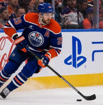 Leon Draisaitl Point Projections 2026-27: Can He Reach 120 Points? Leon Draisaitl skating in an Edmonton Oilers home jersey during his projected 119-point 2026-27 fantasy hockey season