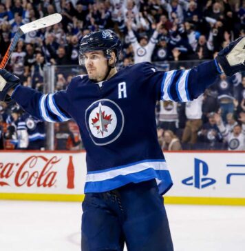 Mark Scheifele Point Projections 2026-27: Winnipeg Jets Fantasy Hockey Outlook Mark Scheifele celebrates for the Winnipeg Jets with Coca-Cola and PS5 board ads in a 2026-27 fantasy hockey point projections preview