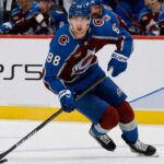 Martin Necas Point Projections 2026-27: Colorado Avalanche Fantasy Outlook Martin Necas skates for the Colorado Avalanche beside a PS5 rink-board ad ahead of his 2026-27 fantasy hockey point projection.