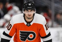 Philadelphia Flyers Linked to Seattle Kraken Center Matty Beniers Matty Beniers wearing a Philadelphia Flyers home jersey and helmet amid NHL trade rumors linking the Seattle Kraken center to Philadelphia.
