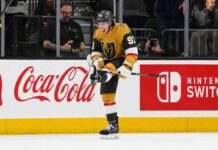 Mitch Marner Point Projections 2026-27: Vegas Golden Knights Fantasy Outlook Mitch Marner celebrates for the Vegas Golden Knights beside Coca-Cola and Nintendo Switch board ads in a 2026-27 fantasy hockey projection.