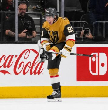 Mitch Marner Point Projections 2026-27: Vegas Golden Knights Fantasy Outlook Mitch Marner celebrates for the Vegas Golden Knights beside Coca-Cola and Nintendo Switch board ads in a 2026-27 fantasy hockey projection.