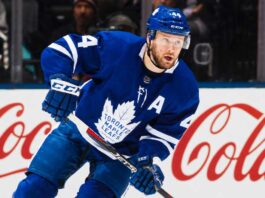 Morgan Rielly’s Four-Team Trade List Leaves the Maple Leafs Facing an Awkward Decision Morgan Rielly skating in a Toronto Maple Leafs home jersey as trade rumours surround his reported four-team destination list.