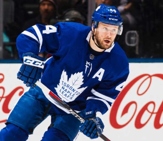 Morgan Rielly’s Four-Team Trade List Leaves the Maple Leafs Facing an Awkward Decision Morgan Rielly skating in a Toronto Maple Leafs home jersey as trade rumours surround his reported four-team destination list.
