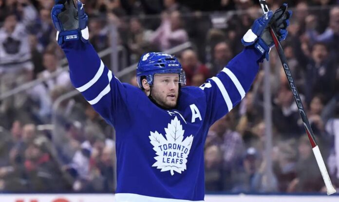 morgan-rielly-maple-leafs-trade-rumors-2026 Toronto Maple Leafs defenseman Morgan Rielly skating amid NHL trade rumors about his availability