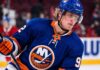 Patrik Laine wearing a New York Islanders home jersey and helmet as he is linked to the team in NHL free agency rumors.