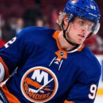 Patrik Laine wearing a New York Islanders home jersey and helmet as he is linked to the team in NHL free agency rumors.