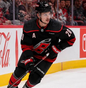 Sebastian Aho Point Projections 2026-27: Carolina Hurricanes Fantasy Outlook Sebastian Aho skating for the Carolina Hurricanes as a left-shot beside Coca-Cola and Nintendo Switch ads in a 2026-27 fantasy hockey projection