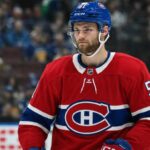 Shane Wright wearing a Montreal Canadiens home jersey amid trade rumors linking the Seattle Kraken center to Montreal