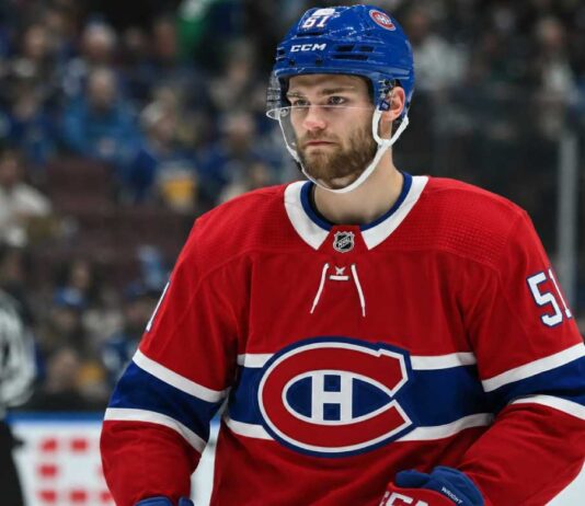 Shane Wright wearing a Montreal Canadiens home jersey amid trade rumors linking the Seattle Kraken center to Montreal