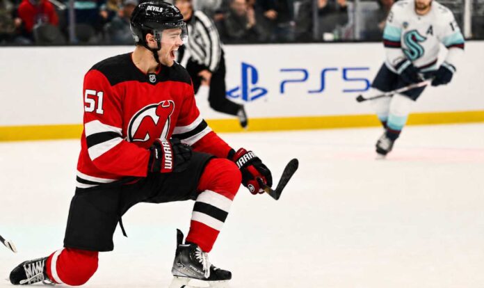 shane-wright-new-jersey-devils-trade-rumors Shane Wright in a New Jersey Devils home jersey during Seattle Kraken trade rumors