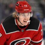 Will the Carolina Hurricanes Offer Sheet Simon Edvinsson? Simon Edvinsson wearing a Carolina Hurricanes home jersey amid NHL offer-sheet rumors involving the Detroit Red Wings
