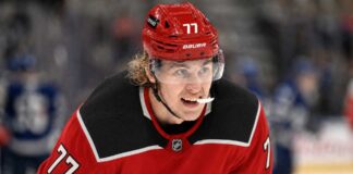 Will the Carolina Hurricanes Offer Sheet Simon Edvinsson? Simon Edvinsson wearing a Carolina Hurricanes home jersey amid NHL offer-sheet rumors involving the Detroit Red Wings