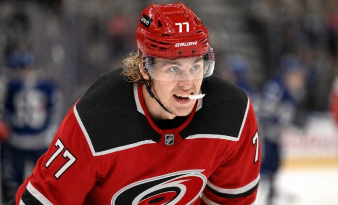 simon-edvinsson-carolina-hurricanes-offer-sheet-rumor Simon Edvinsson wearing a Carolina Hurricanes home jersey amid NHL offer-sheet rumors involving the Detroit Red Wings