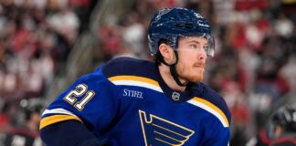 Blues Still Want Alexander Nikishin, but Carolina’s Asking Price Creates a Major Problem Alexander Nikishin wearing a St. Louis Blues home jersey amid NHL trade rumors involving the Carolina Hurricanes