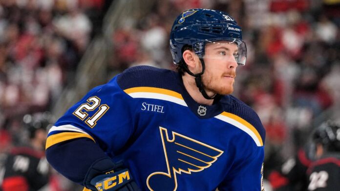st-louis-blues-alexander-nikishin-trade-rumors Alexander Nikishin wearing a St. Louis Blues home jersey amid NHL trade rumors involving the Carolina Hurricanes