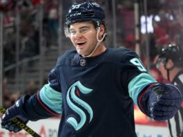 Seattle Kraken Linked to Alex DeBrincat as Red Wings Face Major Decision Concept image for Alex DeBrincat trade rumours showing a hockey player in a Seattle Kraken home jersey and helmet