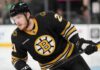 Alexander Nikishin in a Boston Bruins home jersey amid NHL trade rumors involving the Carolina Hurricanes