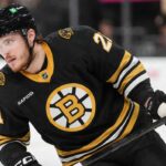 Alexander Nikishin in a Boston Bruins home jersey amid NHL trade rumors involving the Carolina Hurricanes