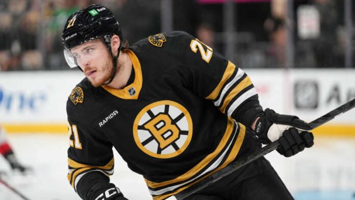 Alexander Nikishin in a Boston Bruins home jersey amid NHL trade rumors involving the Carolina Hurricanes