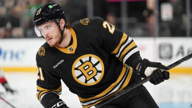 Alexander Nikishin in a Boston Bruins home jersey amid NHL trade rumors involving the Carolina Hurricanes