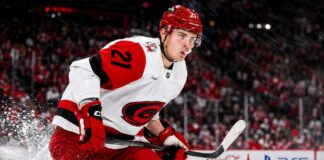 Alexander Nikishin skating for the Carolina Hurricanes amid NHL trade rumors and RFA contract speculation.