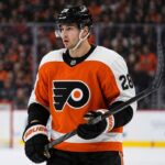 Alexander Romanov in a Philadelphia Flyers home jersey as the New York Islanders defenseman is linked to Philadelphia in NHL trade rumors.