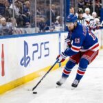 Alexis Lafreniere Point Projections 2026-27: New York Rangers Fantasy Outlook Alexis Lafreniere skating for the New York Rangers beside Coca-Cola and PS5 board ads in a 2026-27 Fantasy Hockey projection