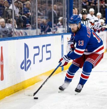 Alexis Lafreniere Point Projections 2026-27: New York Rangers Fantasy Outlook Alexis Lafreniere skating for the New York Rangers beside Coca-Cola and PS5 board ads in a 2026-27 Fantasy Hockey projection