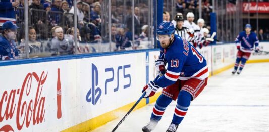 Alexis Lafreniere skating for the New York Rangers beside Coca-Cola and PS5 board ads in a 2026-27 Fantasy Hockey projection