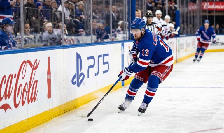 Alexis Lafreniere skating for the New York Rangers beside Coca-Cola and PS5 board ads in a 2026-27 Fantasy Hockey projection