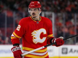 Arber Xhekaj Linked to Calgary Flames as Canadiens Face Major Decision Arber Xhekaj wearing a Calgary Flames home jersey amid NHL trade rumors involving the Montreal Canadiens