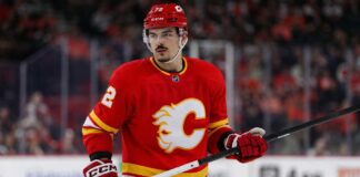Arber Xhekaj Linked to Calgary Flames as Canadiens Face Major Decision Arber Xhekaj wearing a Calgary Flames home jersey amid NHL trade rumors involving the Montreal Canadiens
