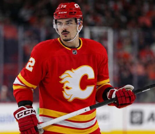 Arber Xhekaj Linked to Calgary Flames as Canadiens Face Major Decision Arber Xhekaj wearing a Calgary Flames home jersey amid NHL trade rumors involving the Montreal Canadiens