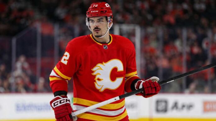 arber-xhekaj-calgary-flames-trade-rumor-2026 Arber Xhekaj wearing a Calgary Flames home jersey amid NHL trade rumors involving the Montreal Canadiens