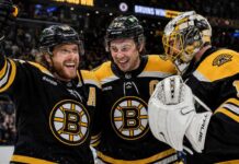 David Pastrnak, Charlie McAvoy and Jeremy Swayman celebrate a Boston Bruins win last season.