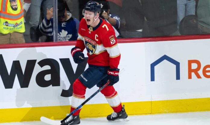 brady-tkachuk-fantasy-hockey-projection-florida-panthers-2026-27 Brady Tkachuk celebrates in a Florida Panthers uniform ahead of his 2026-27 fantasy hockey projection.