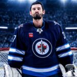 Connor Hellebuyck in a Winnipeg Jets jersey amid Buffalo Sabres trade rumors ahead of NHL training camp