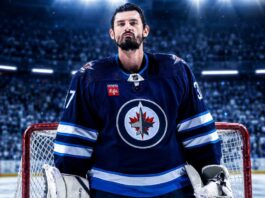 Connor Hellebuyck in a Winnipeg Jets jersey amid Buffalo Sabres trade rumors ahead of NHL training camp